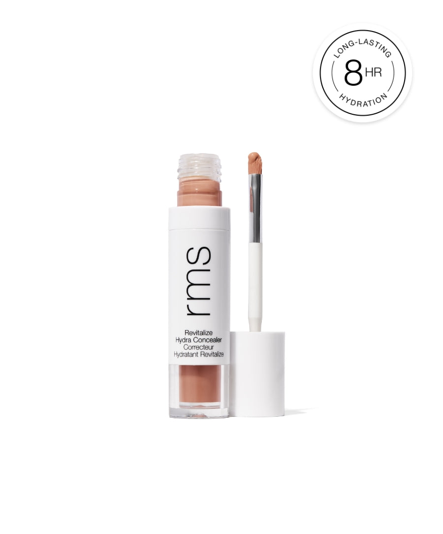 Revitalize Hydra Concealer with a sleek white tube and applicator, offering long-lasting hydration for up to 8 hours, featuring clean beauty and skin-loving ingredients.