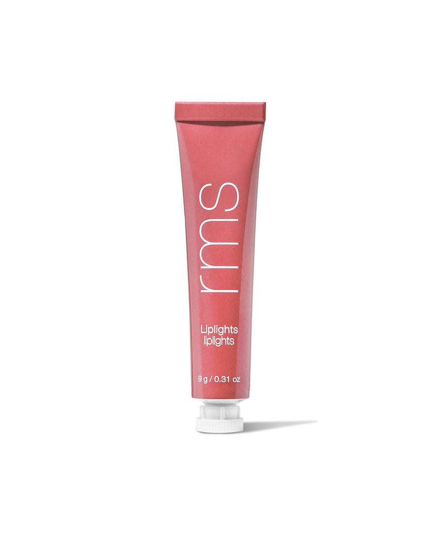 A pink tube of Liplights Cream Lip Gloss by RMS Beauty featuring clean, natural ingredients in recyclable packaging, designed as a sustainable, cruelty-free makeup option.