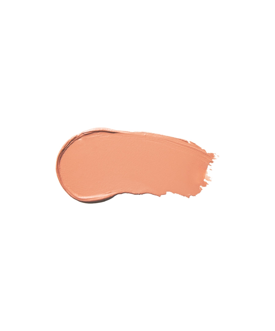 Smooth swatch of warm, matte peach color from Cashmere Matte Eyelights, showcasing clean beauty and natural ingredients with a soft, velvety texture.