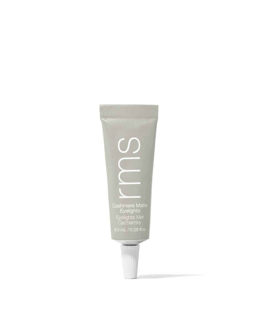 Tube of Cashmere Matte Eyelights makeup in soft neutral shade, featuring clean beauty formula with natural ingredients in recyclable packaging by RMS Beauty.