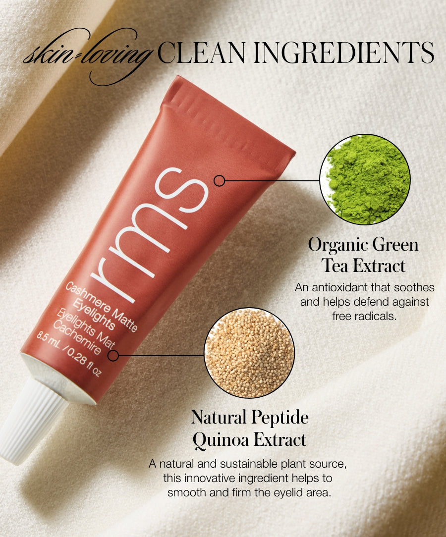 Tube of Cashmere Matte Eyelights makeup by RMS Beauty lying on fabric with close-ups of green tea extract and quinoa extract powders highlighting clean, natural ingredients for skincare infused makeup.