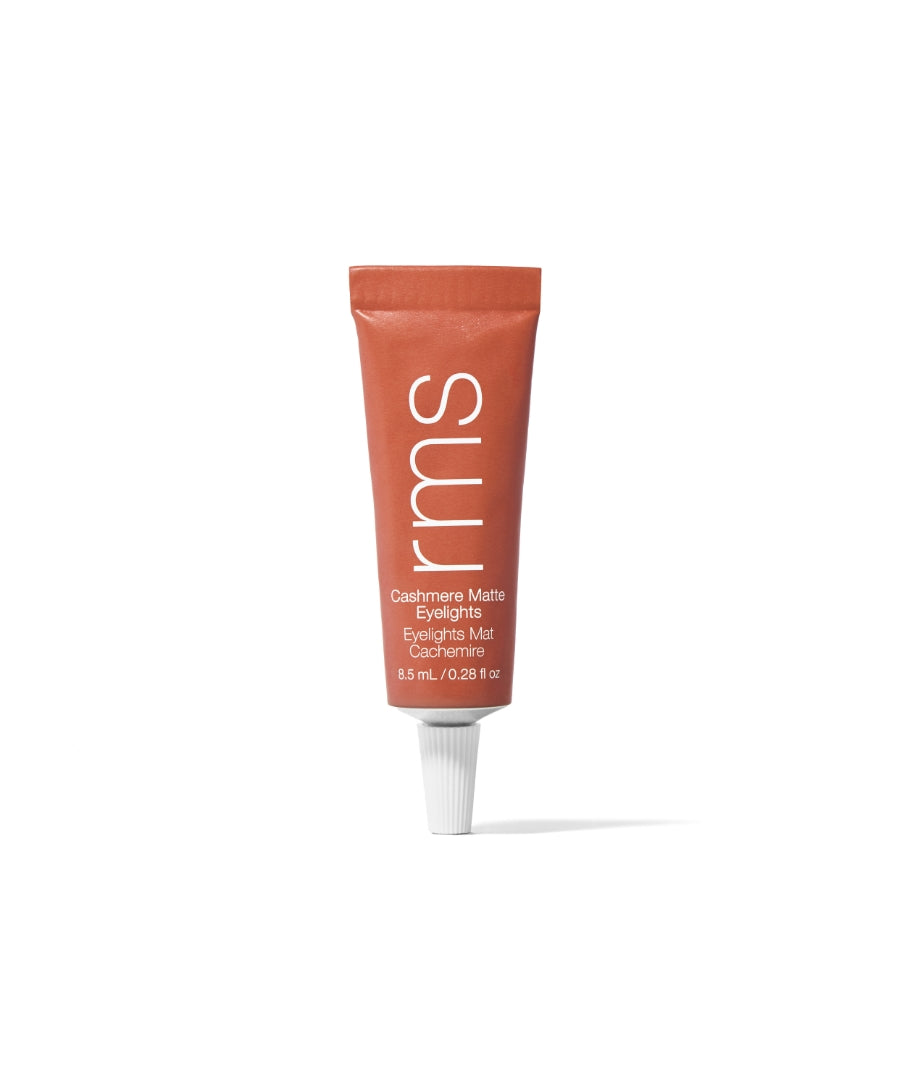 A tube of Cashmere Matte Eyelights in a warm clay shade standing upright on a white background, featuring clean beauty and natural ingredients for a matte finish.