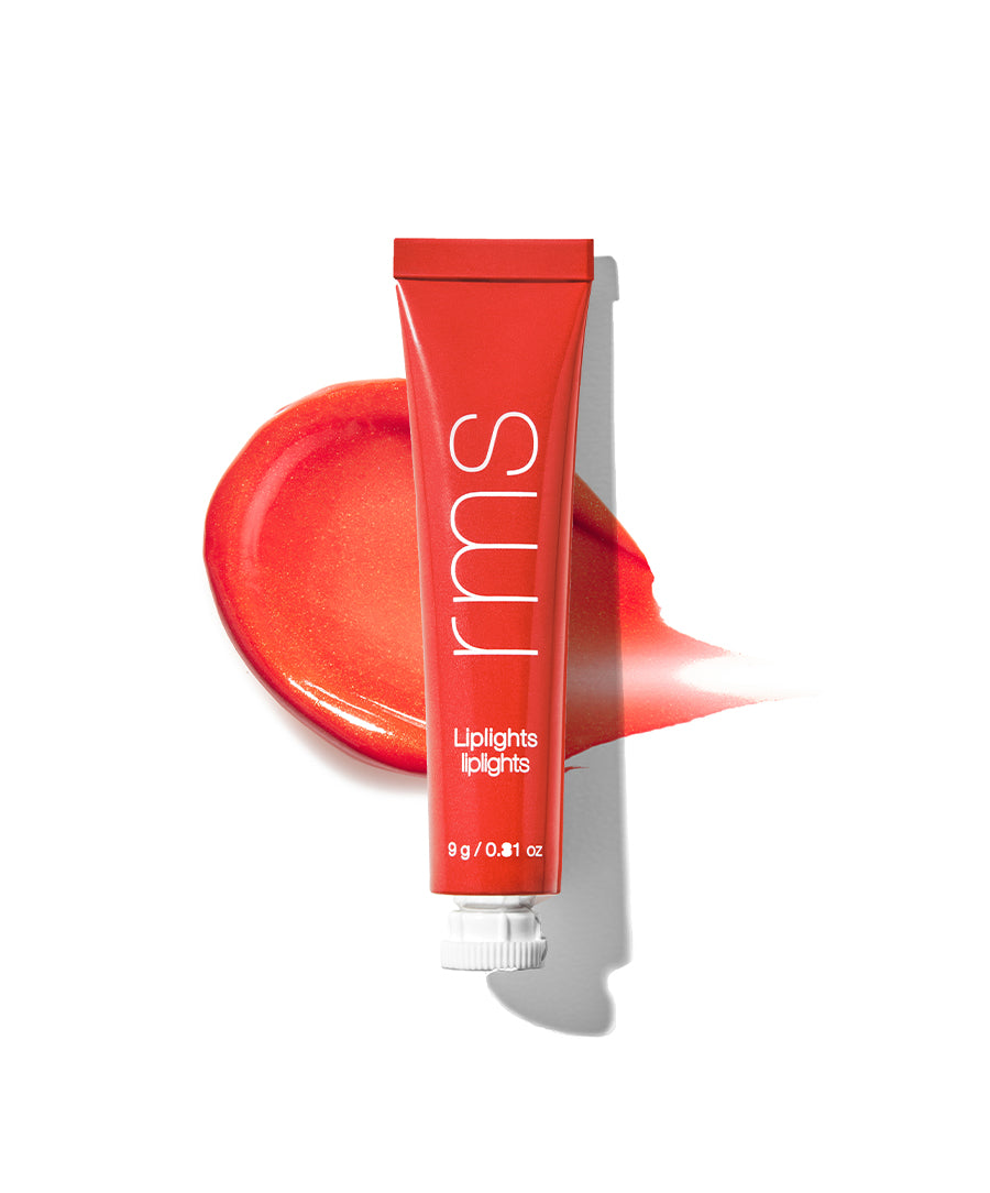 Red tube of Liplights Cream Lip Gloss with a smooth red-orange gloss swatch behind it, highlighting clean beauty and natural ingredients for a radiant lip look.
