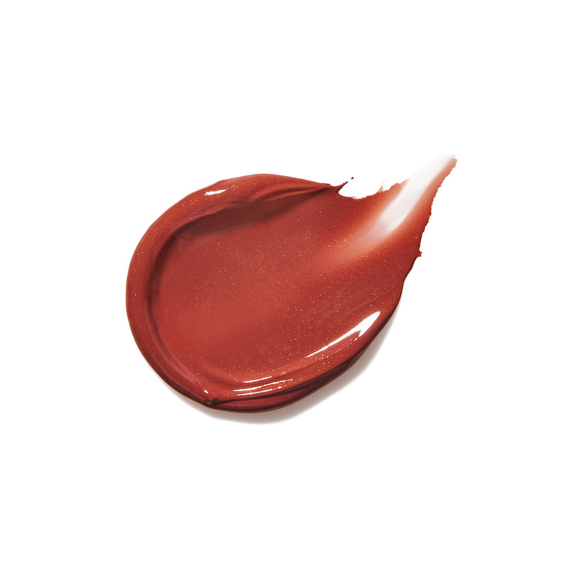 Smooth swatch of reddish cream lip gloss with subtle shimmer showcasing the glossy texture and rich pigmentation of Liplights Cream Lip Gloss for a radiant, natural look.