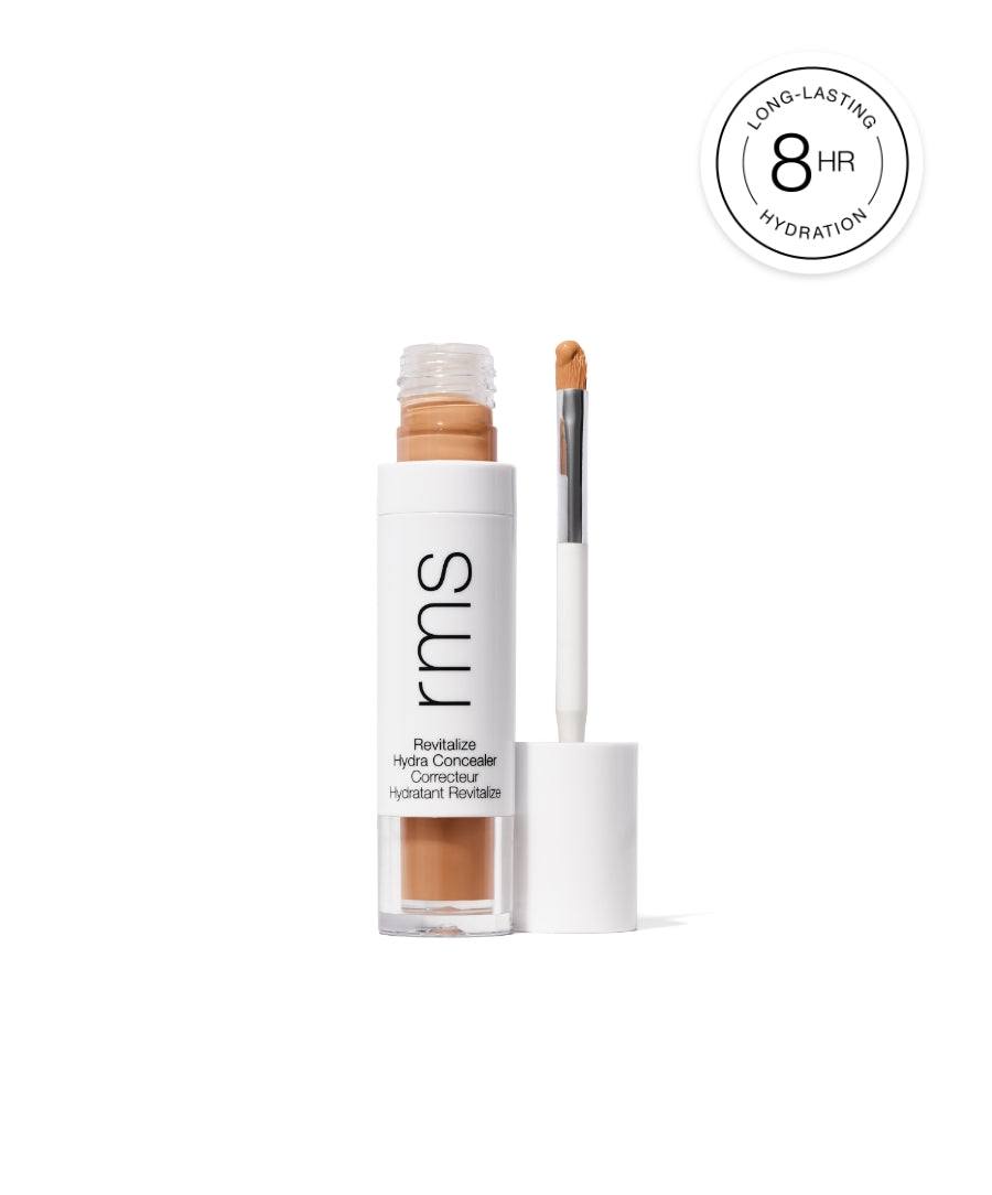 Revitalize Hydra Concealer with a sleek white tube and applicator brush, offering long-lasting hydration for up to 8 hours, made with clean, natural ingredients.