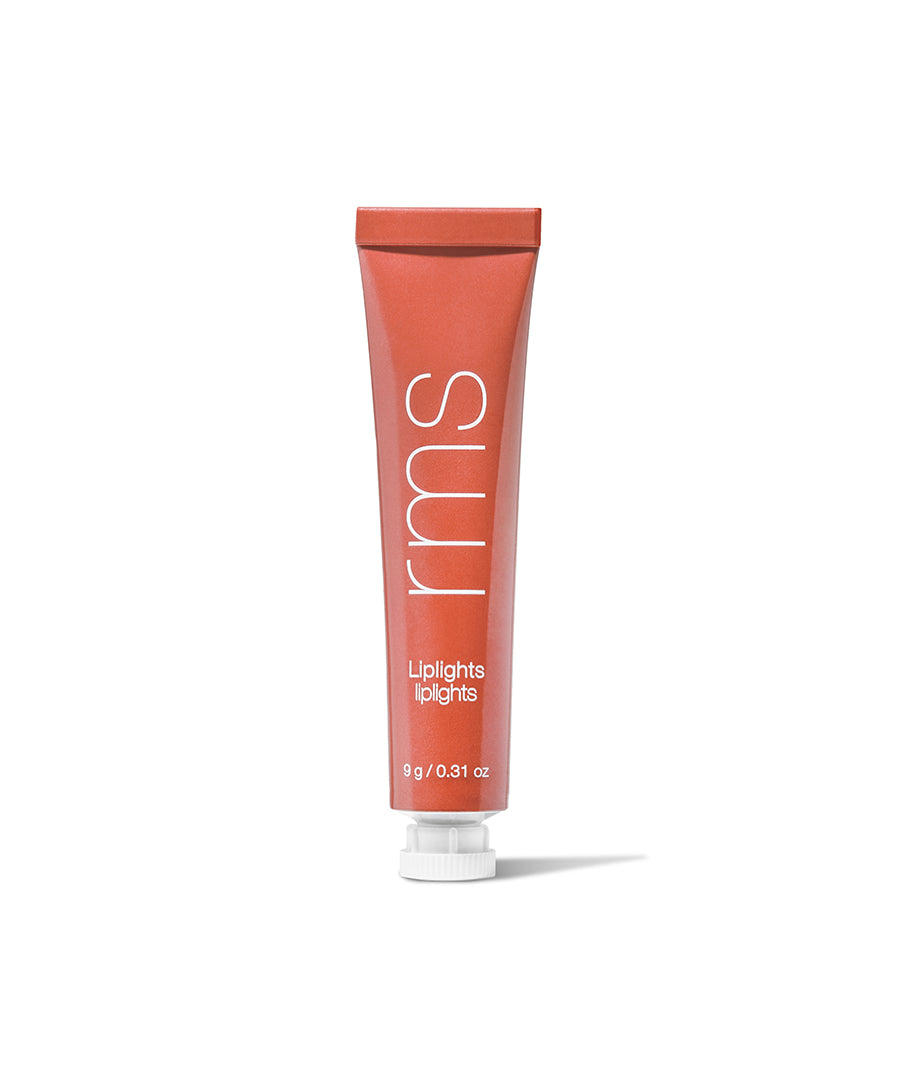 Tube of RMS Beauty Liplights Cream Lip Gloss in a warm coral shade, featuring clean beauty and natural ingredients for a skincare infused makeup look.