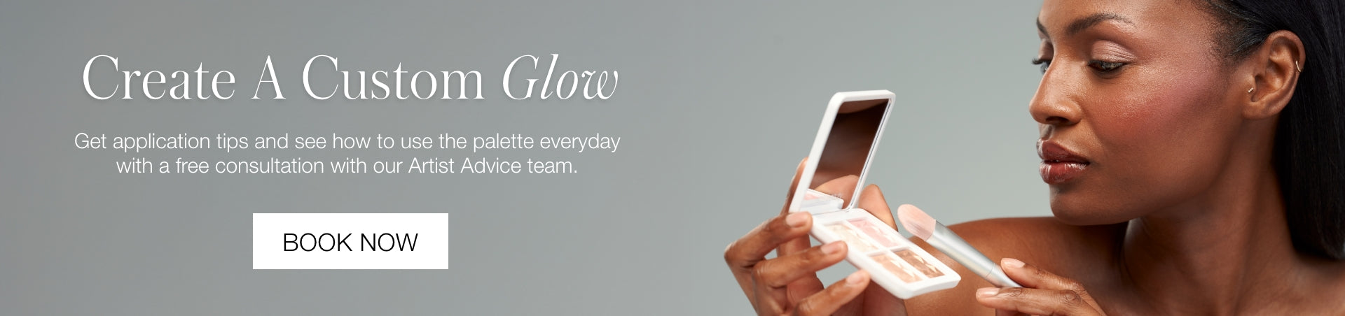 Woman holding a compact makeup palette with a mirror, looking at it thoughtfully against a neutral background with text about creating a custom glow and booking a consultation.