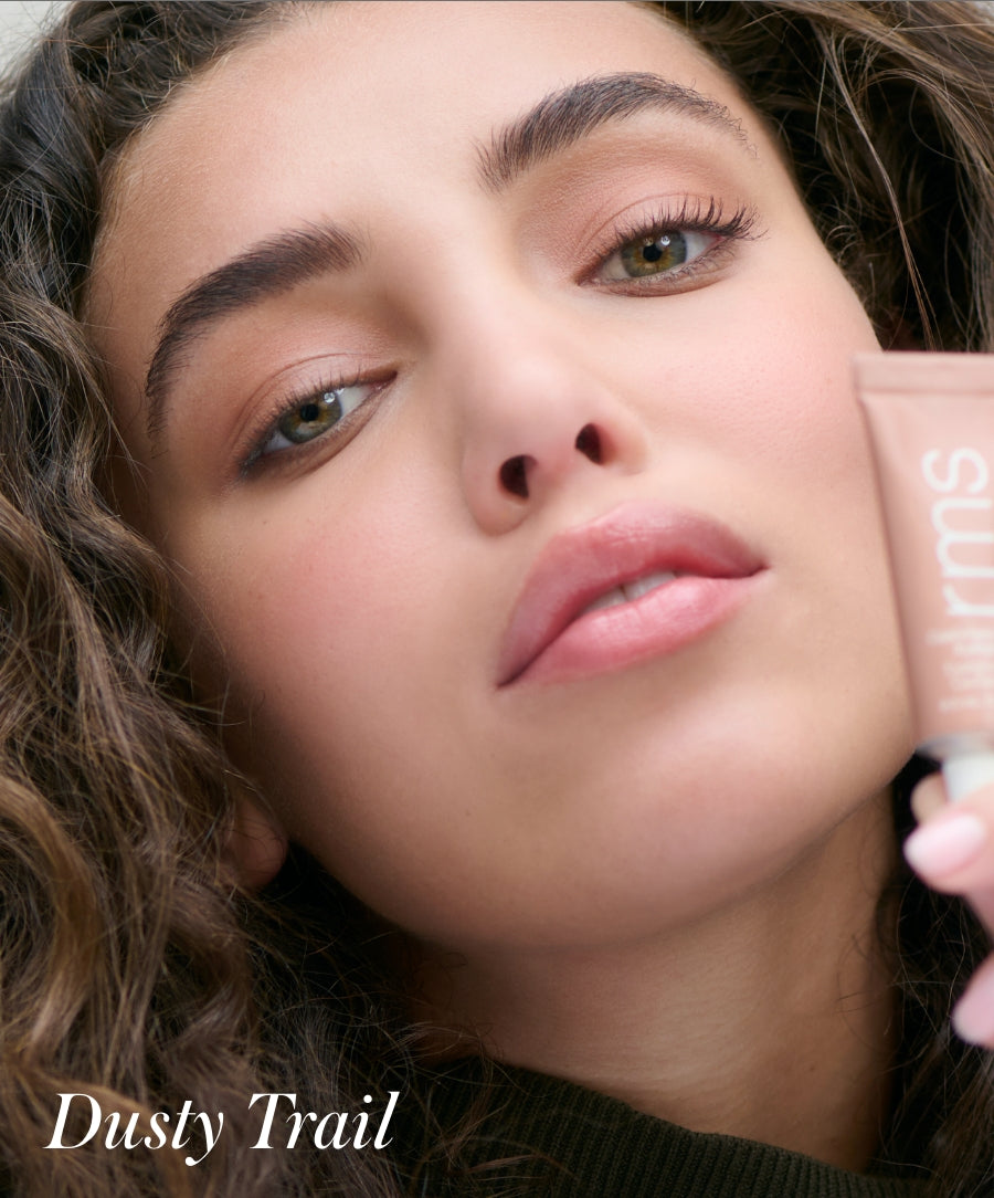Close-up of a woman with natural makeup wearing Cashmere Matte Eyelights in a soft, dusty trail shade, highlighting clean beauty and smooth, matte finish.