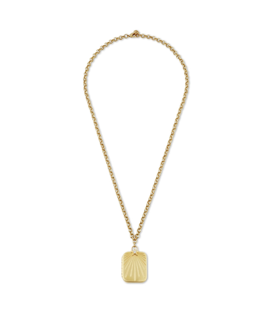 HART x RMS: Lip2Cheek Locket gold-tone necklace with a rectangular pendant featuring a sunburst pattern on a fine chain, embodying clean beauty and sustainable packaging principles.