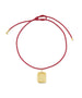 HART x RMS: Lip2Cheek Locket featuring a gold-tone engraved pendant on an adjustable deep red cord, combining elegant jewelry design with clean beauty inspiration.