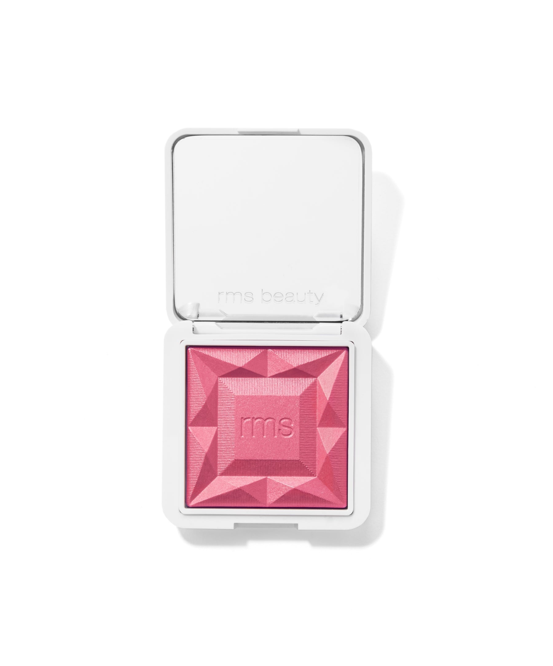 Open compact featuring a pink geometric powder makeup with embossed rms logo, representing ReDimension Hydra Powder Blush with clean beauty and sustainable packaging.