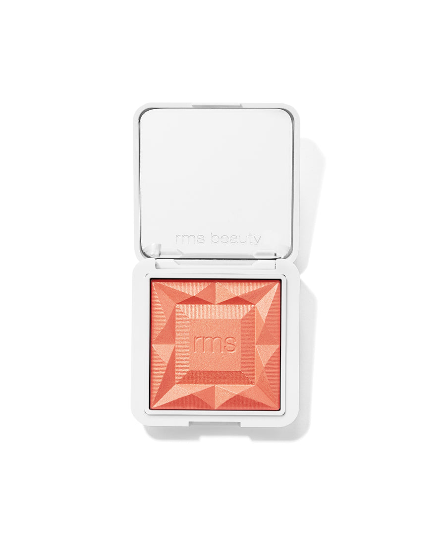 Open compact showing orange coral ReDimension Hydra Powder Blush with geometric embossed design by RMS Beauty, cruelty free makeup with clean ingredients and sustainable packaging.