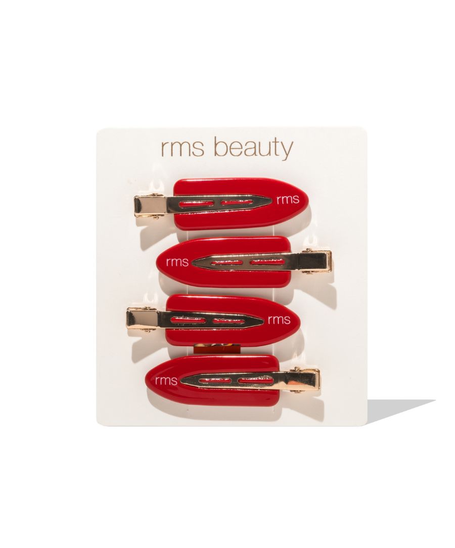 Set of four glossy red RMS Creaseless Red Hair Clips with gold-tone metal accents on a white branded card, designed for gentle, crease-free hair styling.