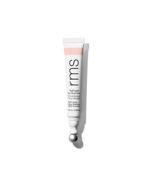 Tube of ReFresh Eye Brightener Broad Spectrum SPF 30 + Correcting Tint by RMS Beauty with a sleek metal applicator tip, highlighting clean beauty and skincare infused makeup.