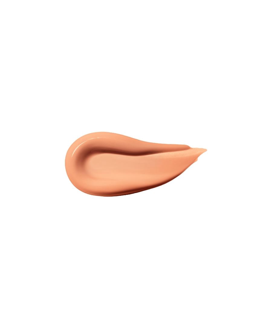 Swatch of ReFresh Eye Brightener Broad Spectrum SPF 30 + Correcting Tint in a warm peachy shade, showcasing smooth, creamy texture with clean beauty and natural ingredients.