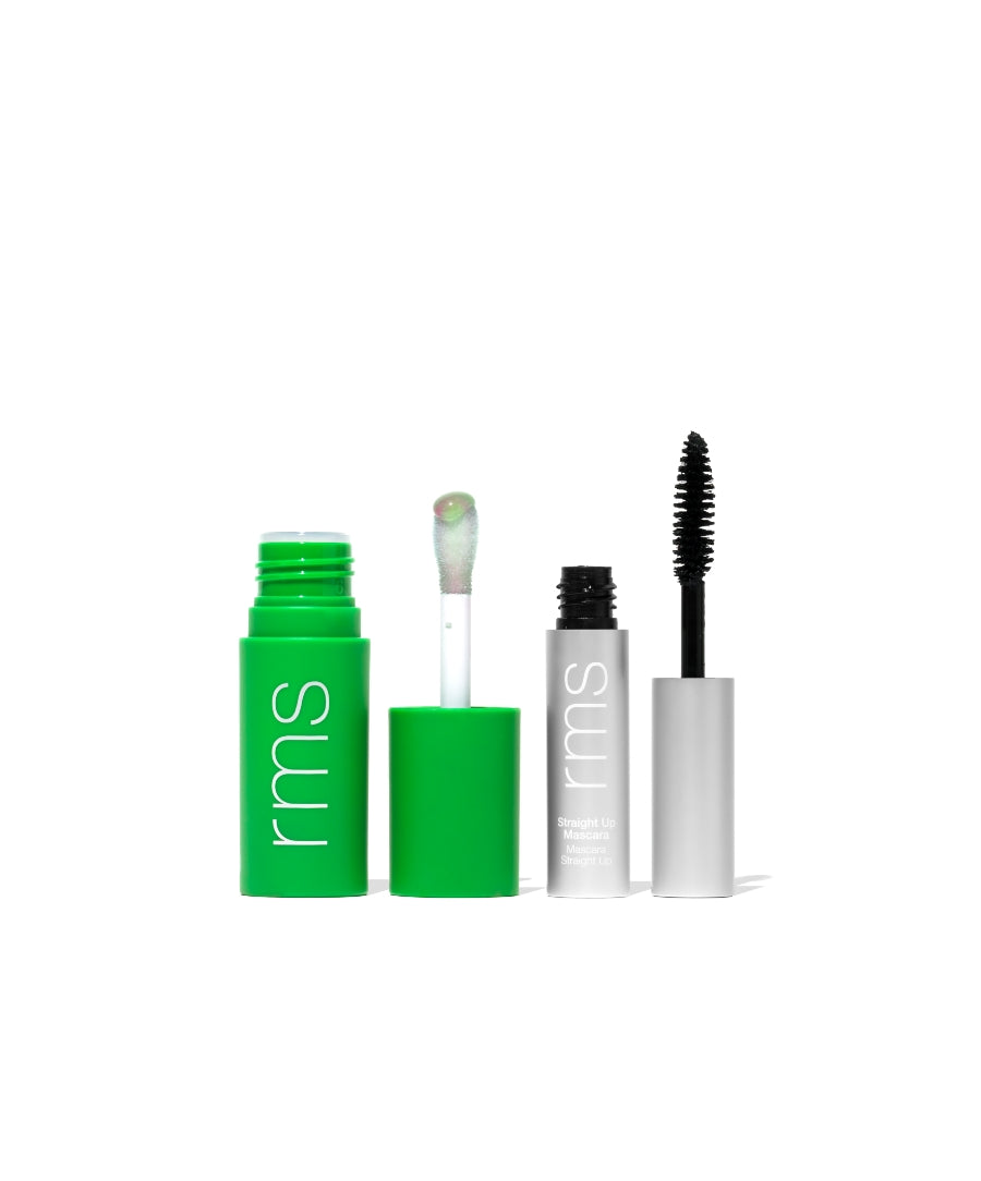 Open tubes of The Lip & Lash Duo: Volumizing Mascara + pH Tinted Lip Oil with green and silver packaging, showing applicators on a white background.