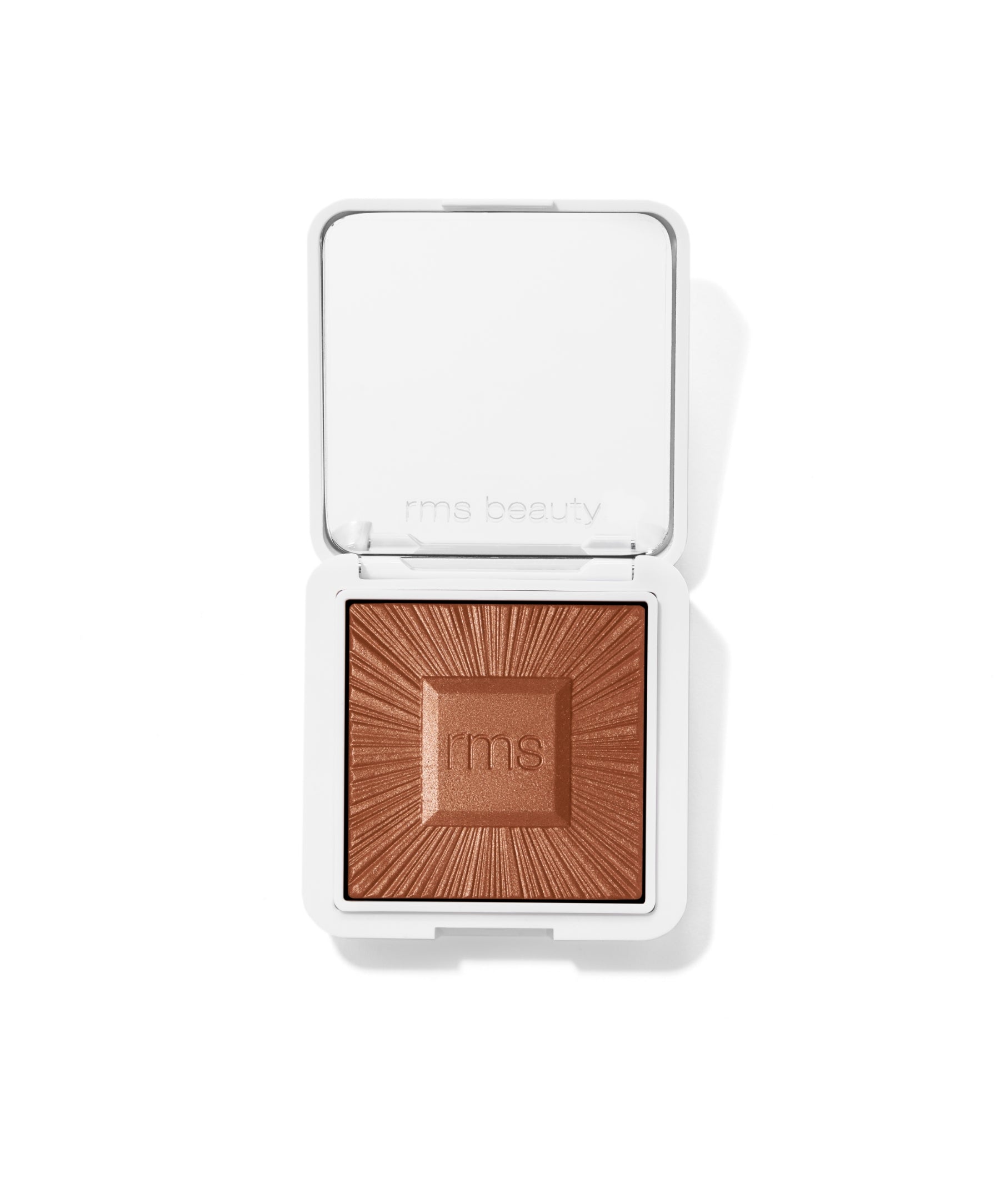 Open white compact with a warm bronze powder embossed with the rms logo, showcasing the ReDimension Hydra Bronzer in natural clean beauty packaging.