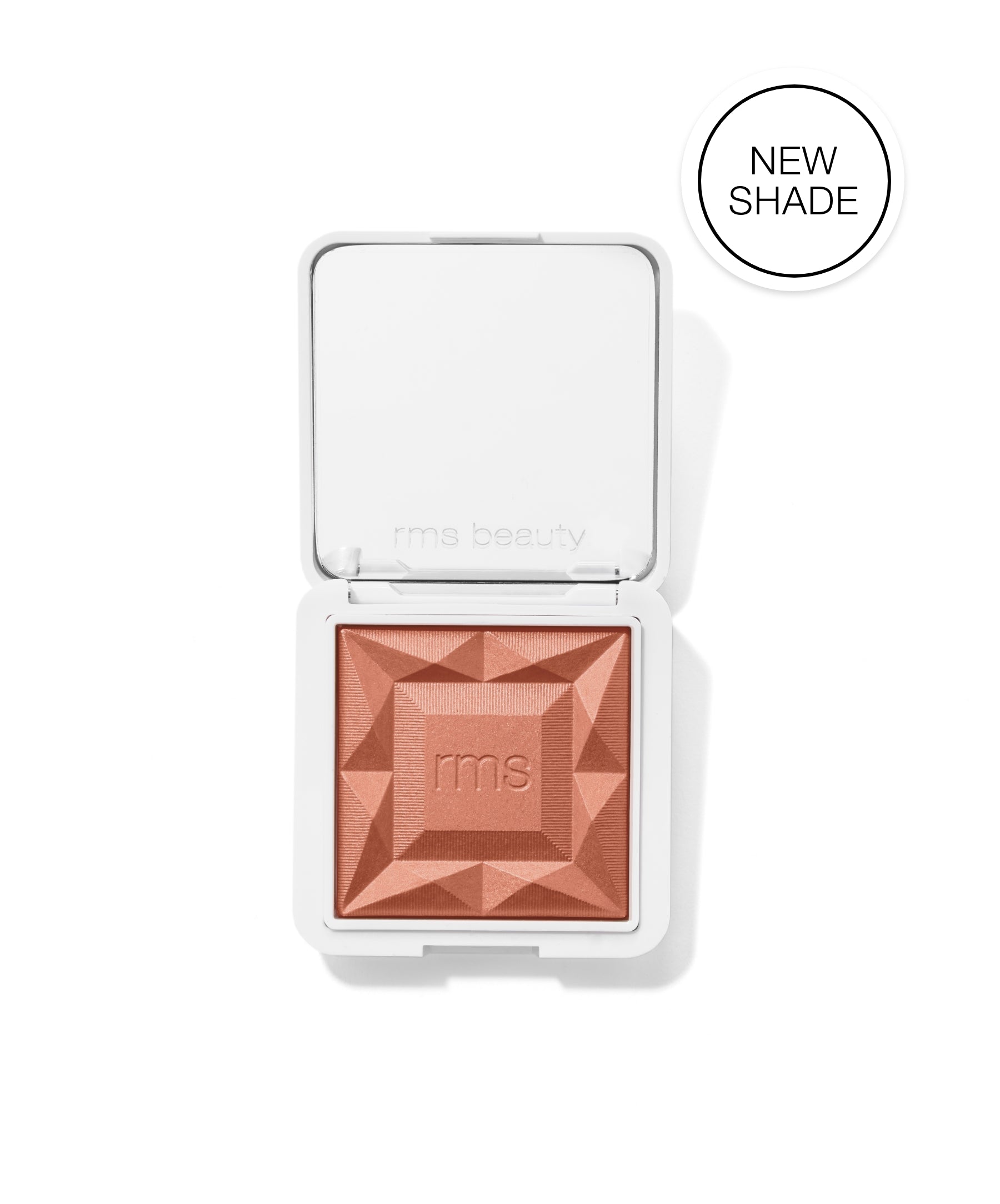 ReDimension Hydra Powder Blush in a new shade, featuring a textured, geometric surface embossed with the rms logo in a warm, natural tone.