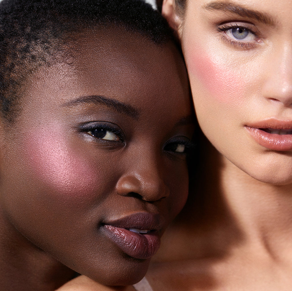 Close-up of two women with radiant skin wearing ReDimension Hydra Powder Blush, showcasing natural, clean beauty makeup with a subtle, glowing finish.
