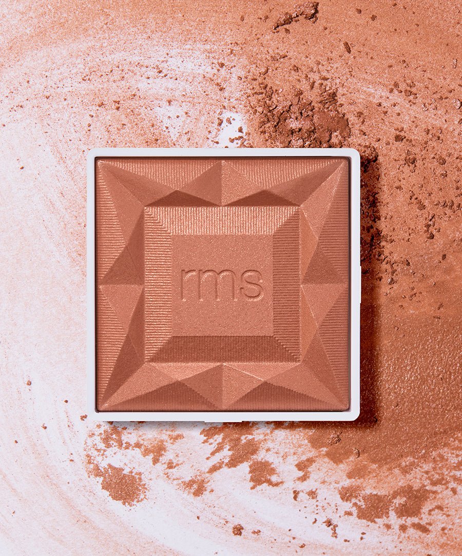 ReDimension Hydra Powder Blush in a warm terracotta shade with a geometric textured surface, highlighting natural ingredients and clean beauty principles.